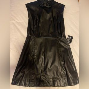 Stylish and trendy black faux leather dress, size 8: back zipper detail.